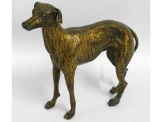 A spelter model of brindle greyhound, 14.25in wide