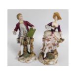 A pair of German Dresden style porcelain figures,