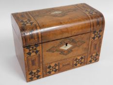 A 19thC. walnut marquetry tea caddy with mother of