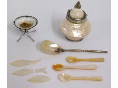 A mother of pearl caviar spoon twinned with other