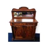 A Victorian mahogany chiffonier with mirrored back