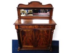 A Victorian mahogany chiffonier with mirrored back