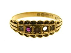 An antique 18ct gold ring set with seed pearl & ru