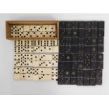 Two early 20thC. dominoes sets, one ebonised with