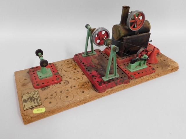 A mounted Mamod stationary steam engine