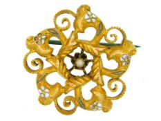 A yellow metal pendant with enamelled decor, tests