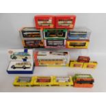 Six boxed Budgie buses, one play worn, one boxed T