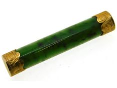 An antique jade bar brooch set with yellow metal e