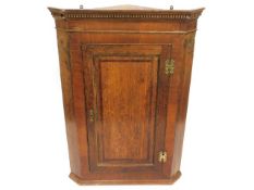 A 19thC. oak corner cupboard, 41in high x 29.25in