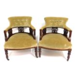 A pair of upholstered antique nursing chairs