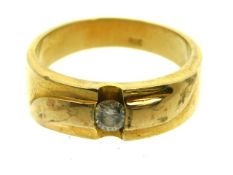 A gents yellow metal solitaire ring set with 0.25c