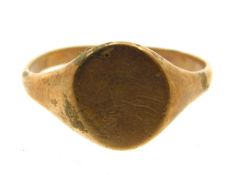 A yellow metal signet ring, tests electronically a