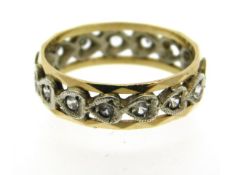 A 9ct two colour gold eternity ring lacking two st