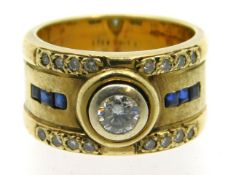 A 9ct gold ring set with collet set diamond & sapp