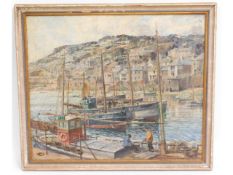 A framed oil painting of possibly Mousehole harbou