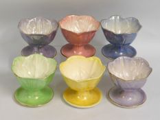 A set of six Maling lustreware dessert dishes of o