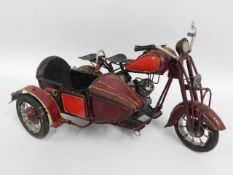 A scale model of a motorcycle & sidecar, 15in long