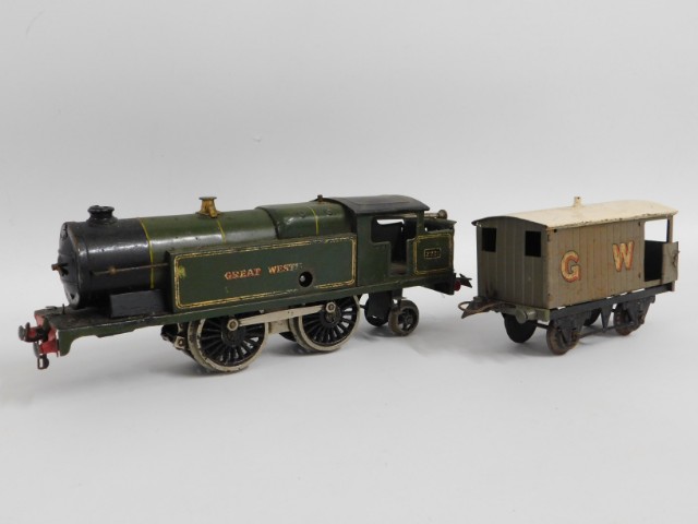 A tin plate clockwork O gauge engine & Hornby wagon