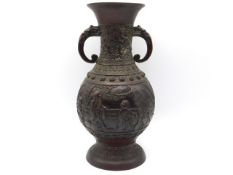 A Chinese relief bronze vase with figures & bats as decor, 10in tall