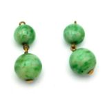 A pair of 1920s jade earrings with rose metal fittings, lacking hooks, 4.7g