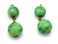 A pair of 1920s jade earrings with rose metal fittings, lacking hooks, 4.7g