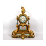 A 19thC. ormolu French clock with figurative decor & Sevres style panels with jewelling, with key. M