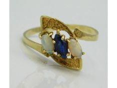 A 14ct gold ring set with sapphire & opal, crack to shank, 1.7g, size P