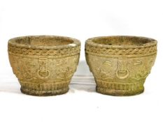 A pair of reconstituted stone planters, 13.5in diameter x 9.5in high