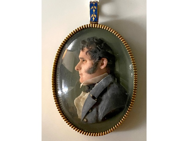 An Italian school, early 19thC. coloured wax miniature portrait plaque from same family as lot 212,