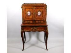 A 19thC. French cabinet with gilt fittings & Sevres style porcelain plaques, some faults, 50in high