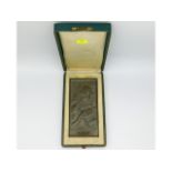 A c. 1920s silk lined cased bronze 'Papiers artistiques Luna vielle & co. Lausanne' plaque after Jea