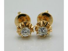 A pair of rose gold diamond earrings with screw backs, approx. 0.3ct, electronically tests as 18ct,