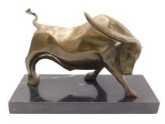 An abstract style bronze bull signed Truffot set on a polished marble mount, 12in wide x 7.75in high