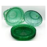 A 1930's seven piece green Jeannette depression glass salad set with pansy decor, plates 9in diamete