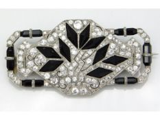 A 1920s art deco white gold diamond & onyx brooch, approx. 63mm x 32mm, tests electronically as 18ct