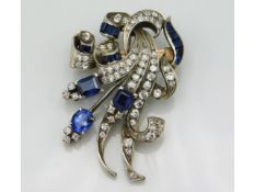 A made up brooch comprising varied carat golds, brooch set with diamonds & blue stones, 48mm x 32mm,