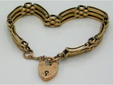 A 9ct rose gold three bar bracelet with padlock clasp, 14.8g