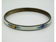 A guilloche enamelled silver bangle with floral decor, internal measurement 64mm