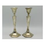 A pair of 1911 Chester silver candle sticks by James Deakin & Sons, 360g inclusive, 8in tall