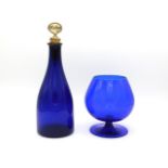 A 19thC. Bristol blue decanter with later Mother of Pearl whisky stopper twinned with a hand blown b
