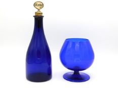 A 19thC. Bristol blue decanter with later Mother of Pearl whisky stopper twinned with a hand blown b