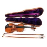 An antique violin with two piece back, sold with its crocodile style skin case & two bows. One bow w