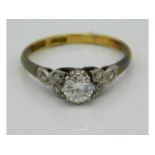 An antique 18ct gold ring with platinum set diamond of 0.5ct with six smaller diamonds on shoulders,