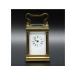 A 19thC. French miniature carriage clock, two chips to bevelled glass, crack to enamel dial, 3in tal