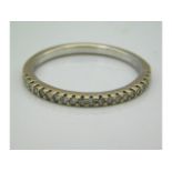 An 18ct gold half eternity ring set with 0.2ct diamonds, 2.1g, size N