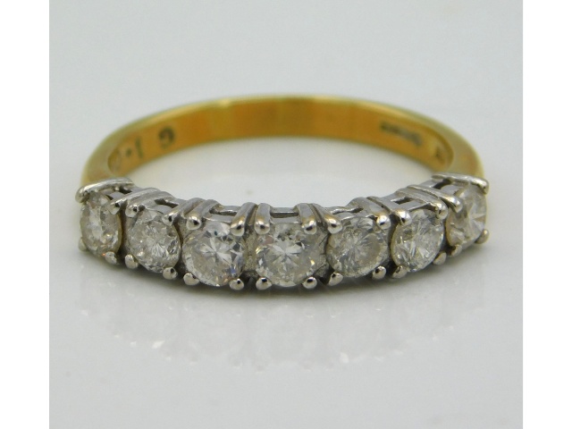 An 18ct gold seven stone diamond half eternity ring, approx. 1ct diamond, 3.2g, size N