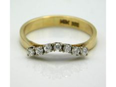 A 14ct gold seven stone diamond ring of approx. 0.14ct, 1.8g, size J/K