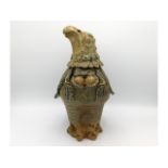 A large Jennie Hale studio pottery jar & cover modelled as a bird of prey, 12.25in tall