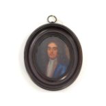 An early 18thC. miniature oil portrait of a gentleman, member of the Churchill family wearing blue c