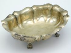 A white metal footed dish of organic form, tests as silver, 100g